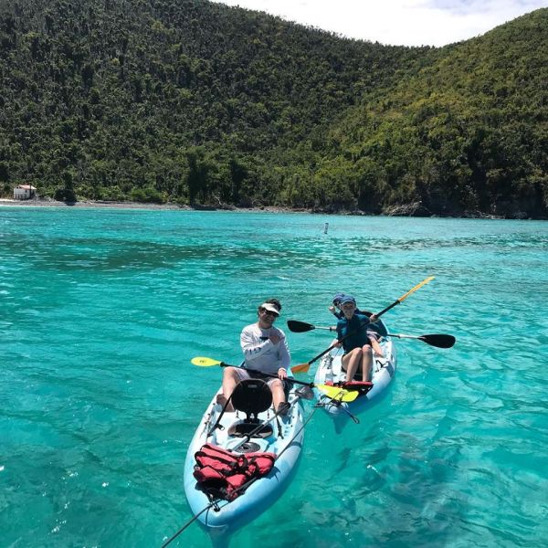 a group of people swimming in a body of water