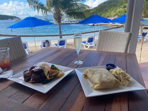 a sandwich sitting on top of a picnic table