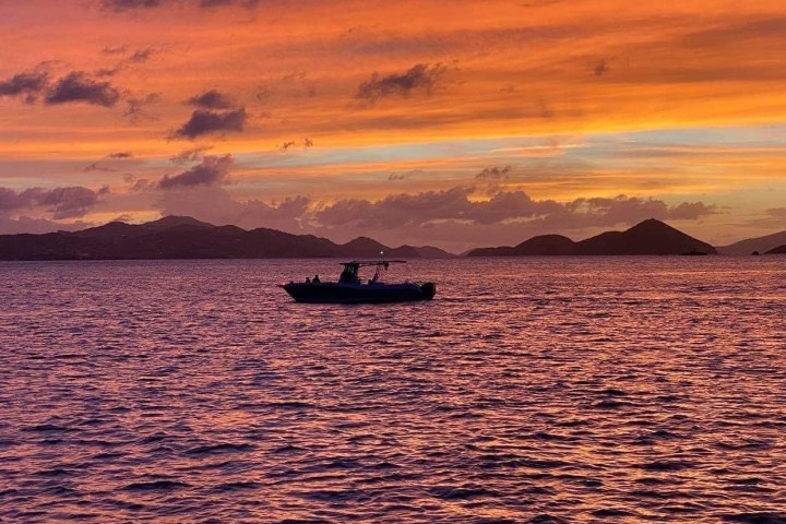 a sunset over a body of water