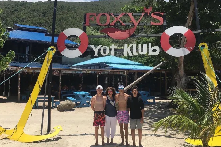 a group of people standing in front of a playground