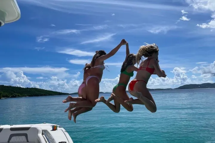 a group of people swimming in a body of water