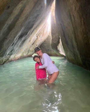 a little girl that is swimming in the water