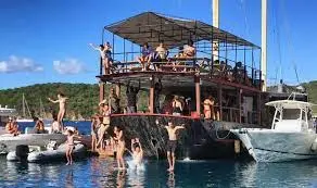 a group of people on a boat in the water