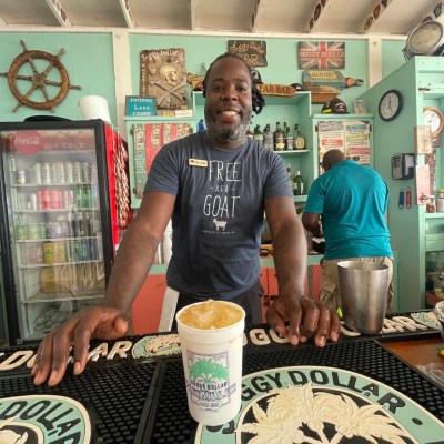 a person sitting at a table in a restaurant