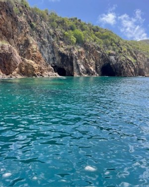 a body of water with a mountain in the background